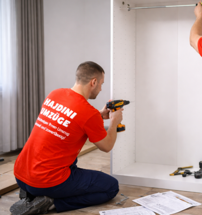 Movers assembling wardrobe in modern apartment