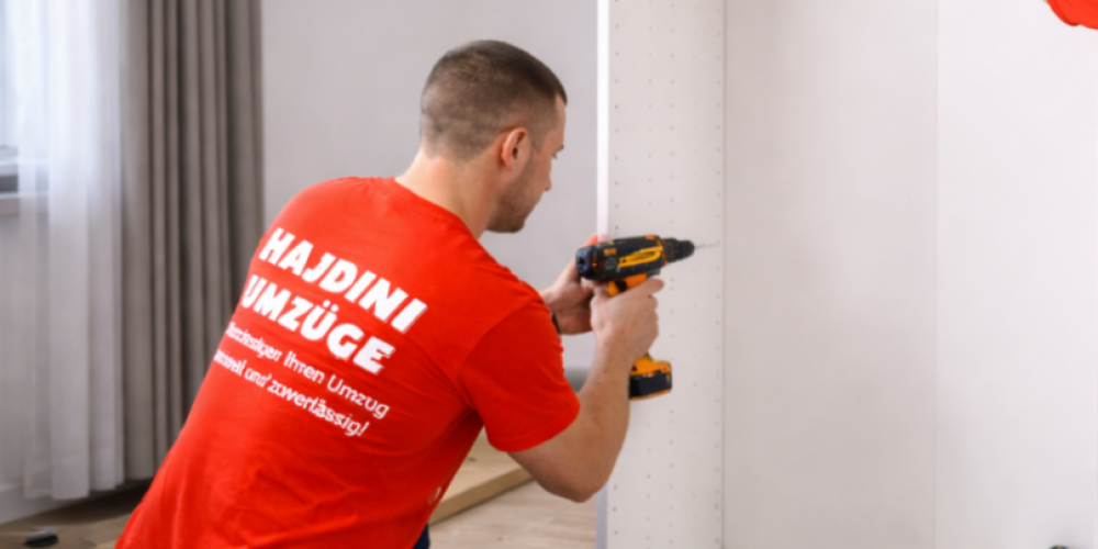 Movers assembling wardrobe in modern apartment